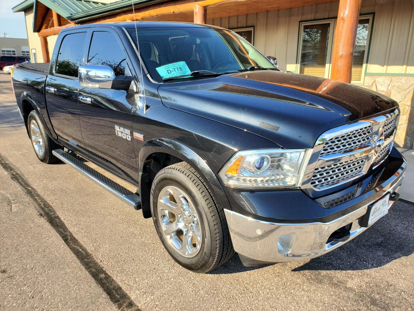 2016 Black /Black Ram 1500 Laramie (1C6RR7NT3GS) with an 5.7L V-8 Hemi engine, 8-Speed Automatic transmission, located at 1600 E Hwy 44, Rapid City, SD, 57703, (605) 716-7878, 44.070232, -103.171410 - Photo#0