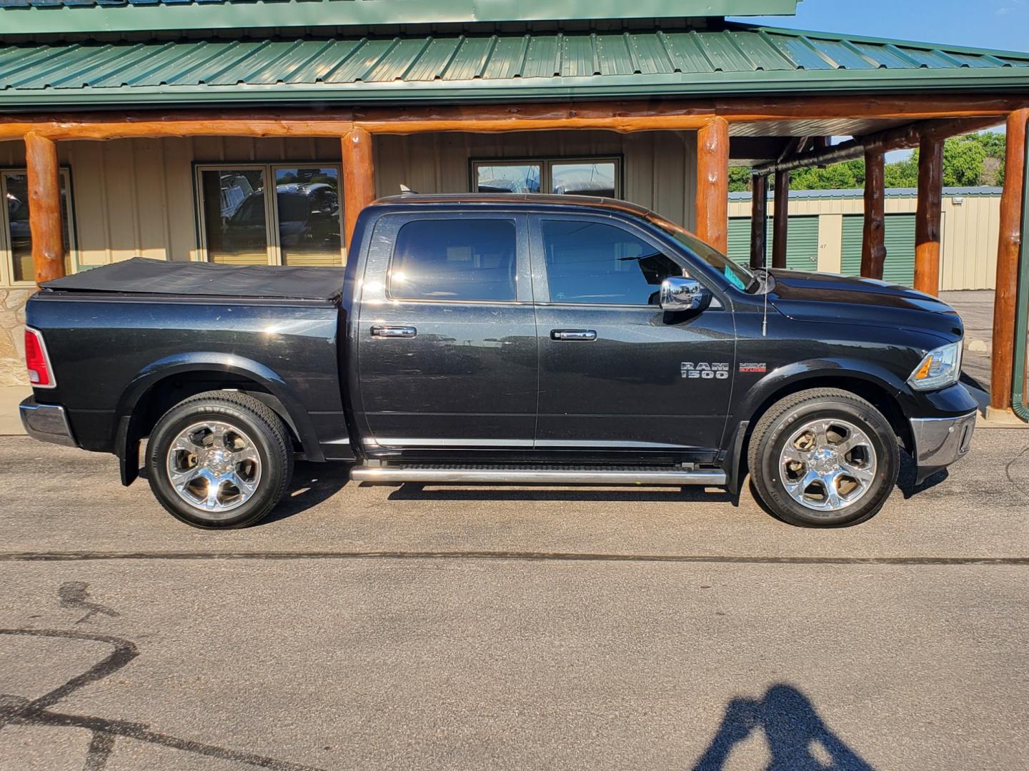 2016 Black /Black Ram 1500 Laramie (1C6RR7NT3GS) with an 5.7L V-8 Hemi engine, 8-Speed Automatic transmission, located at 1600 E Hwy 44, Rapid City, SD, 57703, (605) 716-7878, 44.070232, -103.171410 - Photo#4