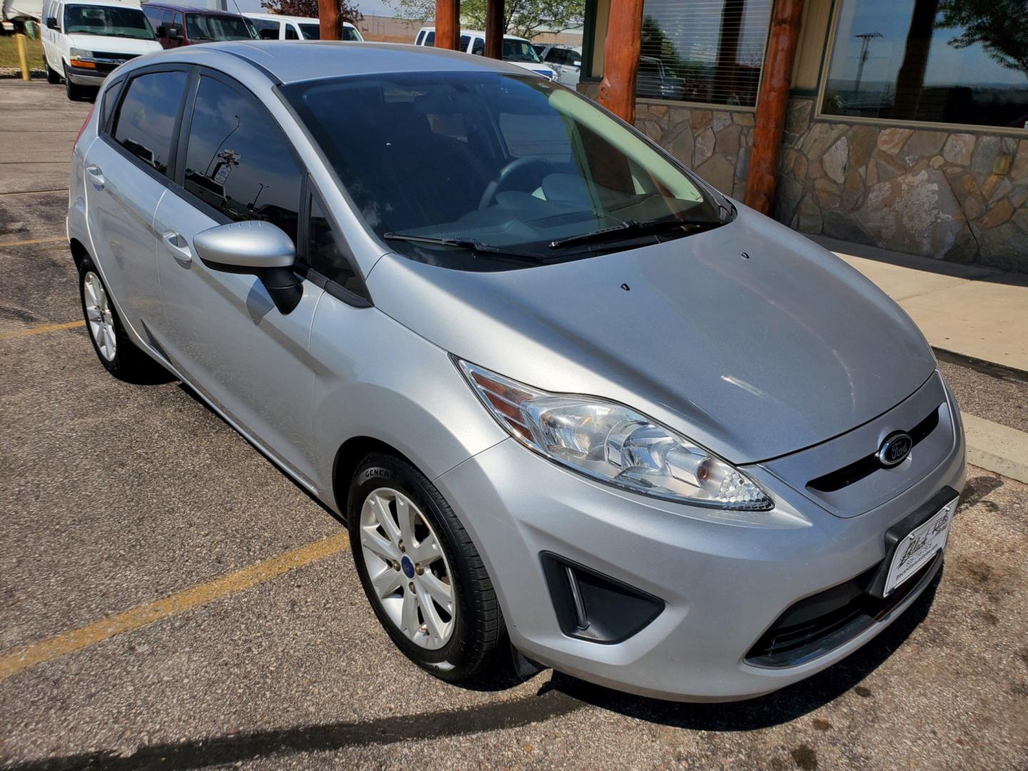 2012 Silver /Black Ford Fiesta SE (3FADP4EJ5CM) with an 1.6l 4Cyl TI-VCT engine, 6-Speed Poweshift transmission, located at 1600 E Hwy 44, Rapid City, SD, 57703, (605) 716-7878, 44.070232, -103.171410 - Photo#0