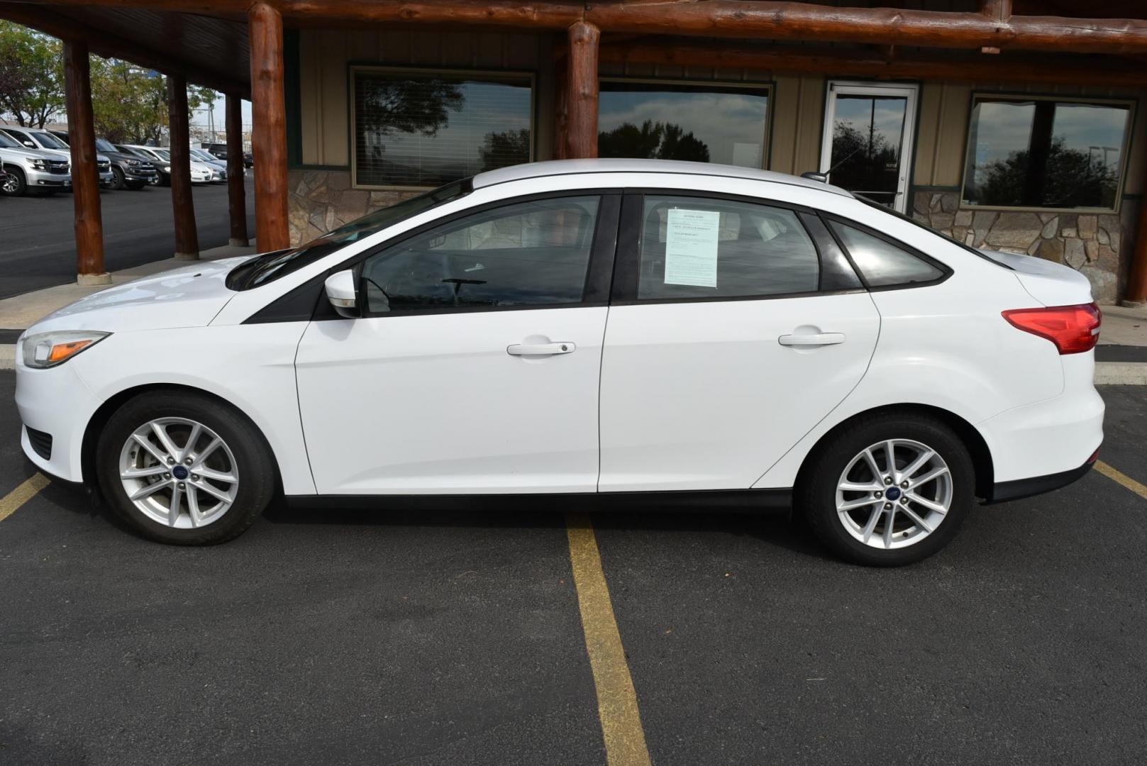 2017 White Ford Focus SE (1FADP3F26HL) with an 2.0L I-4 GDI TI-VCT engine, 6-Speed Powershift Automatic transmission, located at 1600 E Hwy 44, Rapid City, SD, 57703, (605) 716-7878, 44.070232, -103.171410 - Photo#3