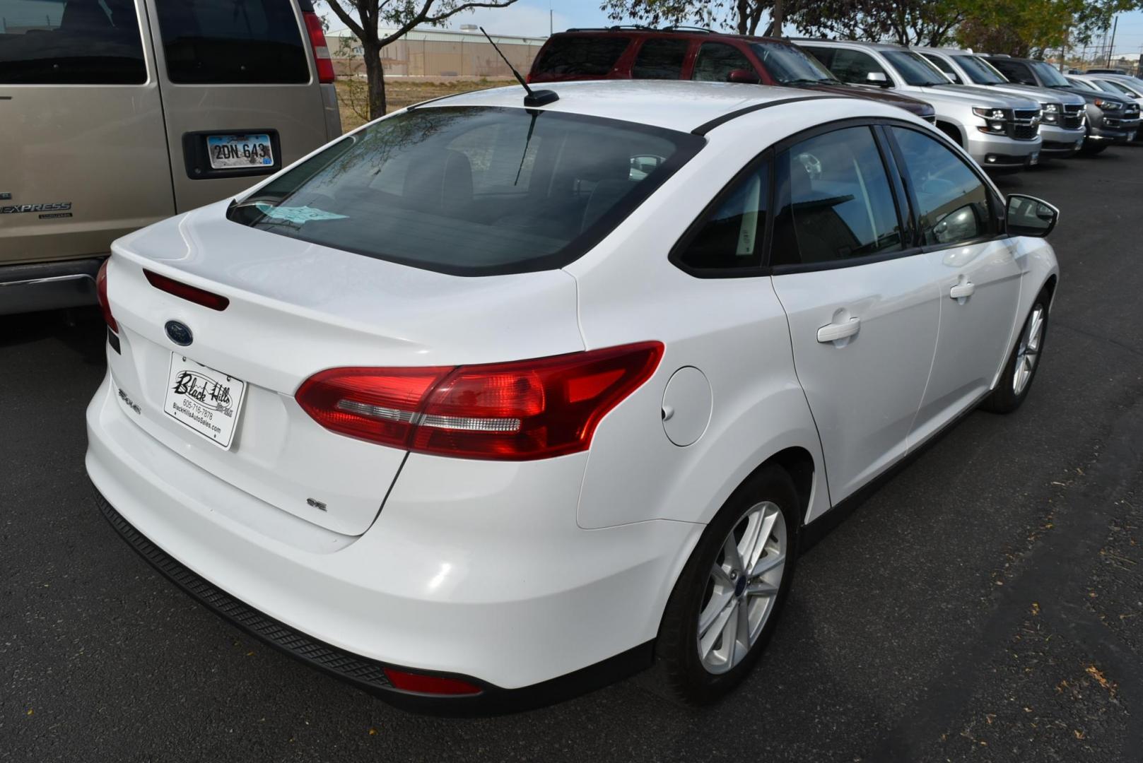 2017 White Ford Focus SE (1FADP3F26HL) with an 2.0L I-4 GDI TI-VCT engine, 6-Speed Powershift Automatic transmission, located at 1600 E Hwy 44, Rapid City, SD, 57703, (605) 716-7878, 44.070232, -103.171410 - Photo#7