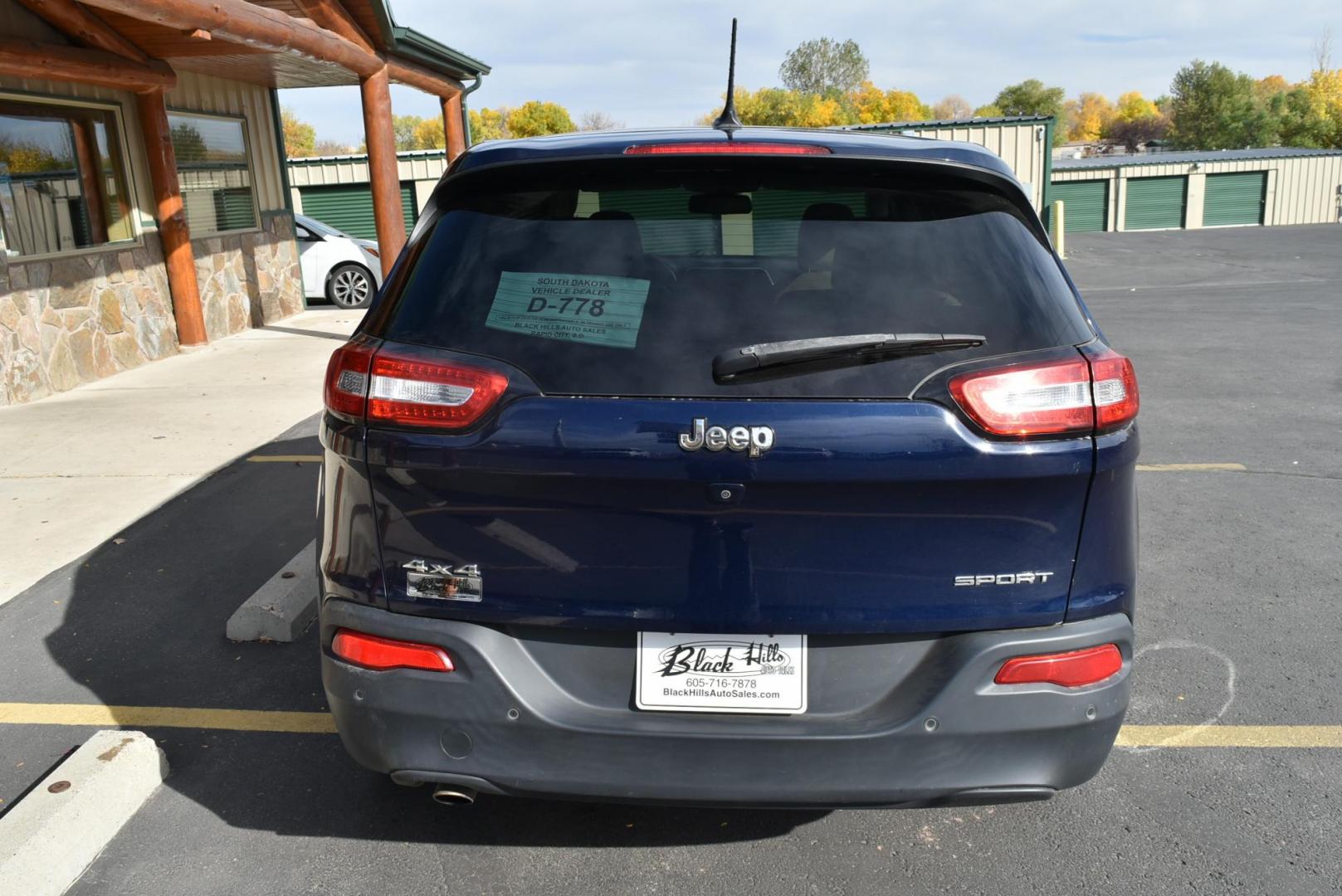 2016 Blue /Tan Jeep Cherokee Sport (1C4PJMABXGW) with an 2.4L 4 Cyl Multiair engine, 9-Speed Automatic transmission, located at 1600 E Hwy 44, Rapid City, SD, 57703, (605) 716-7878, 44.070232, -103.171410 - Photo#5