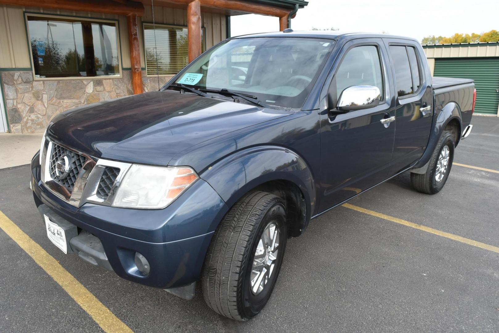 2016 Black Nissan Frontier SV (1N6AD0EV1GN) with an 4.0L v-6 engine, 5-Speed Automatic transmission, located at 1600 E Hwy 44, Rapid City, SD, 57703, (605) 716-7878, 44.070232, -103.171410 - Photo#2