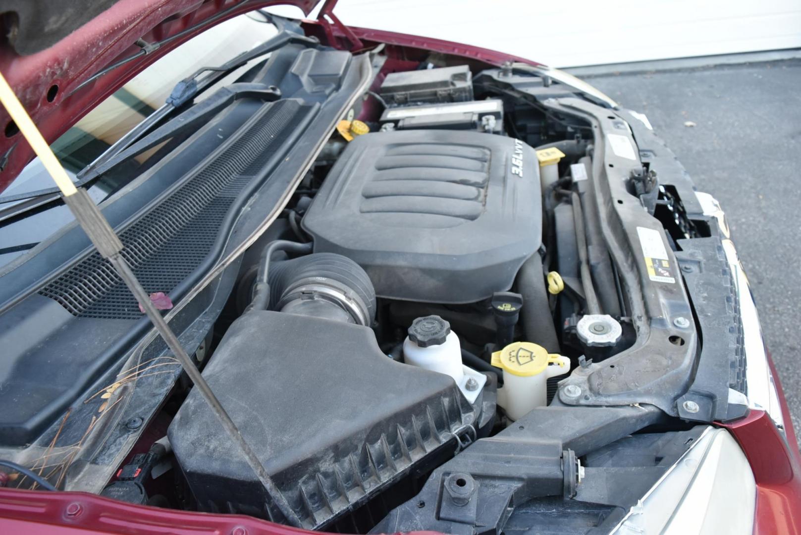 2014 Red /Black Dodge Grand Caravan SE (2C4RDGBGXER) with an 3.6L V6 VVT engine, 6-Speed Automatic transmission, located at 1600 E Hwy 44, Rapid City, SD, 57703, (605) 716-7878, 44.070232, -103.171410 - Photo#27