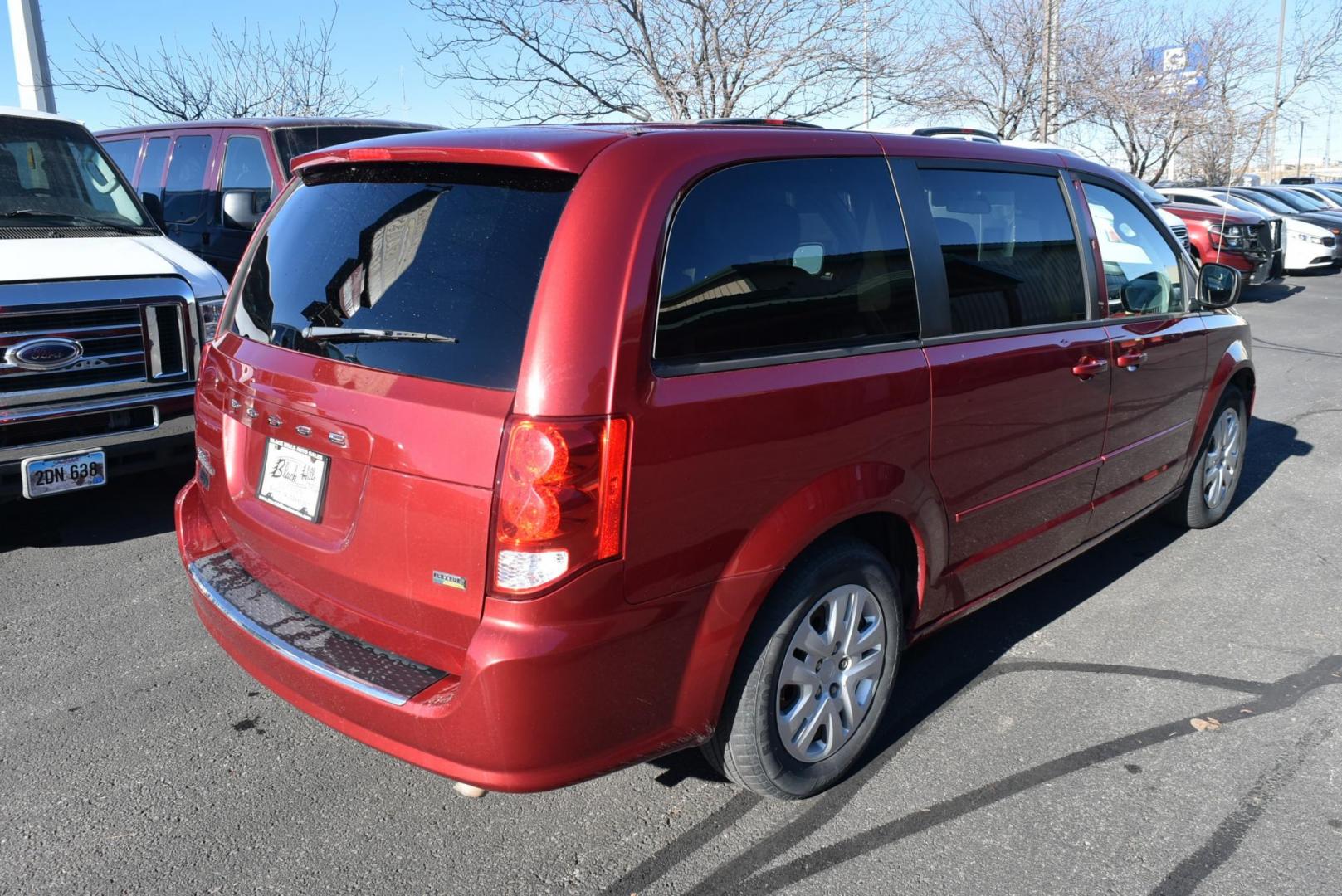 2014 Red /Black Dodge Grand Caravan SE (2C4RDGBGXER) with an 3.6L V6 VVT engine, 6-Speed Automatic transmission, located at 1600 E Hwy 44, Rapid City, SD, 57703, (605) 716-7878, 44.070232, -103.171410 - Photo#7