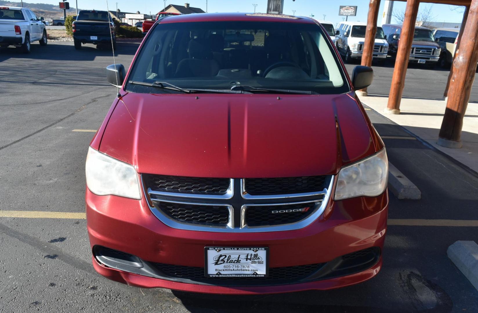 2014 Red /Black Dodge Grand Caravan SE (2C4RDGBGXER) with an 3.6L V6 VVT engine, 6-Speed Automatic transmission, located at 1600 E Hwy 44, Rapid City, SD, 57703, (605) 716-7878, 44.070232, -103.171410 - Photo#1